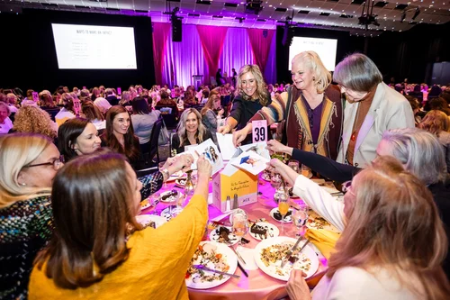 Guests sharing a moment over dinner at Seawell Ballroom, Denver