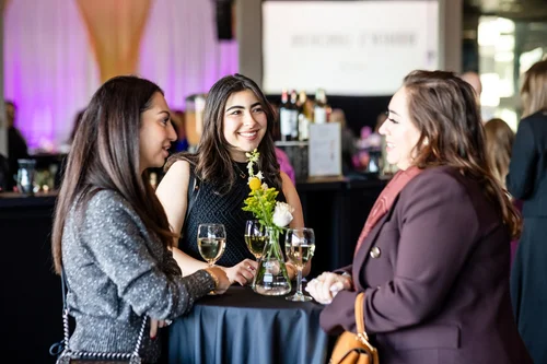 Guests in candid conversation during cocktail hour at Seawell Ballroom, Denver