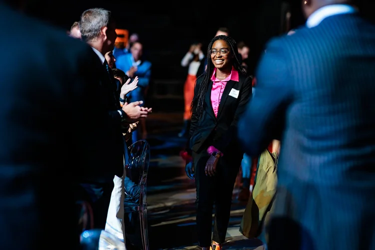 Award honoree walking the aisle at Denver Broncos Honors Awards Mission Ballroom Colorado