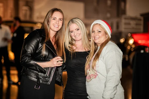 Black and white corporate holiday party photography at Vehicle Vault Parker Colorado