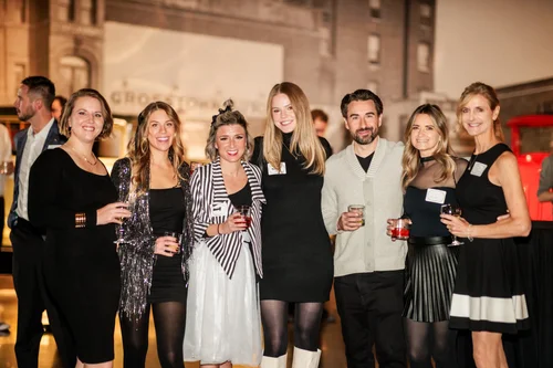 Group of colleagues at corporate holiday party Vehicle Vault Parker Colorado event photography