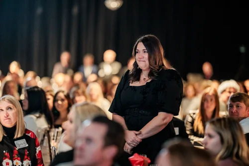 Employee being recognized during corporate holiday party program Vehicle Vault Parker Colorado
