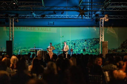 Stage and program at Vehicle Vault Parker Colorado holiday party