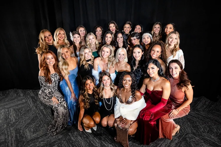 Corporate event photography on the field at Empower Field Mile High Denver Broncos holiday party