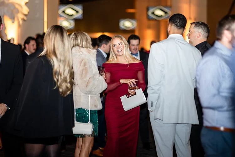 Candid portrait corporate holiday party event photography Denver Broncos Mile High