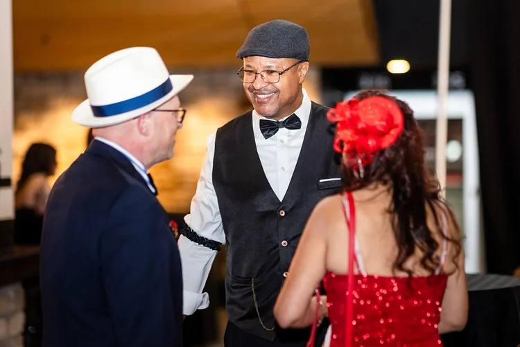 Employee portrait corporate holiday party Denver Broncos Empower Field Mile High