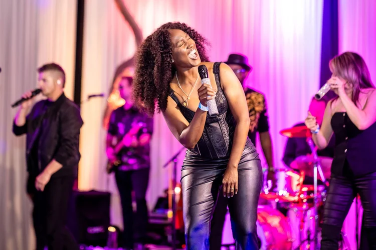 Group portrait corporate holiday party event photography Empower Field Denver Colorado