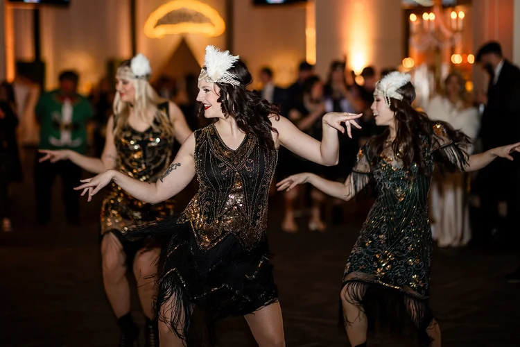 Dancing and entertainment at corporate holiday party event photography Empower Field Denver Colorado