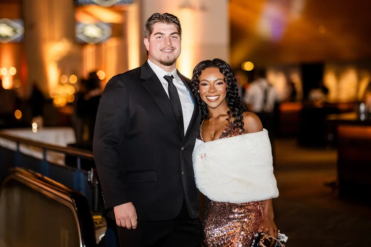 Denver Broncos cheerleader performing at corporate holiday party Empower Field Denver