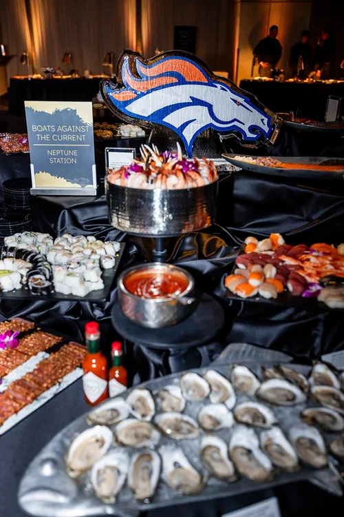 Food station corporate holiday party event photography Denver Broncos Empower Field