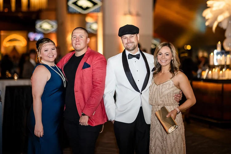 Event portrait photography at corporate holiday party Empower Field Denver Colorado