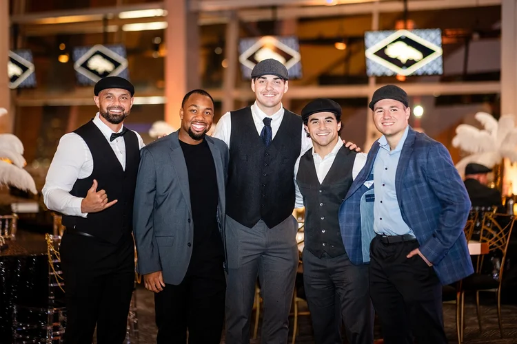 Posed portrait corporate holiday party event photography Denver Broncos Mile High