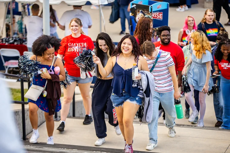 Students at MSU Denver homecoming tailgate face painting event photography Denver Colorado