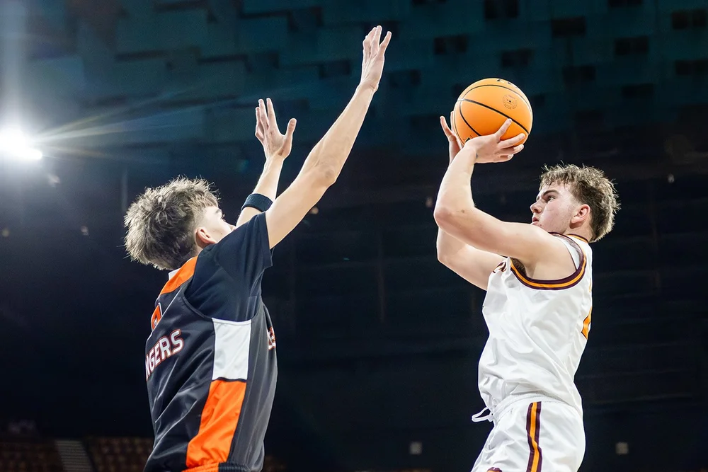 Jump shot over defender Colorado 5A boys basketball playoffs Denver Coliseum