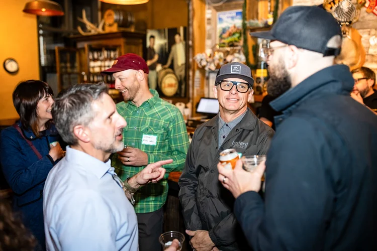 Event registration at Stranahan's Distillery Denver corporate event photography