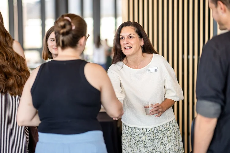 Networking conversation at DU University of Denver event photographer Denver