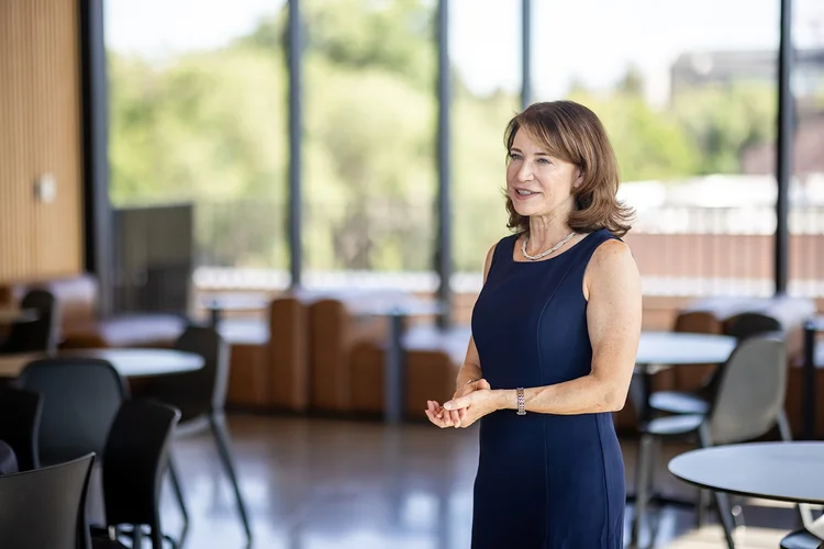 Candid networking moment at University of Denver intern event photography